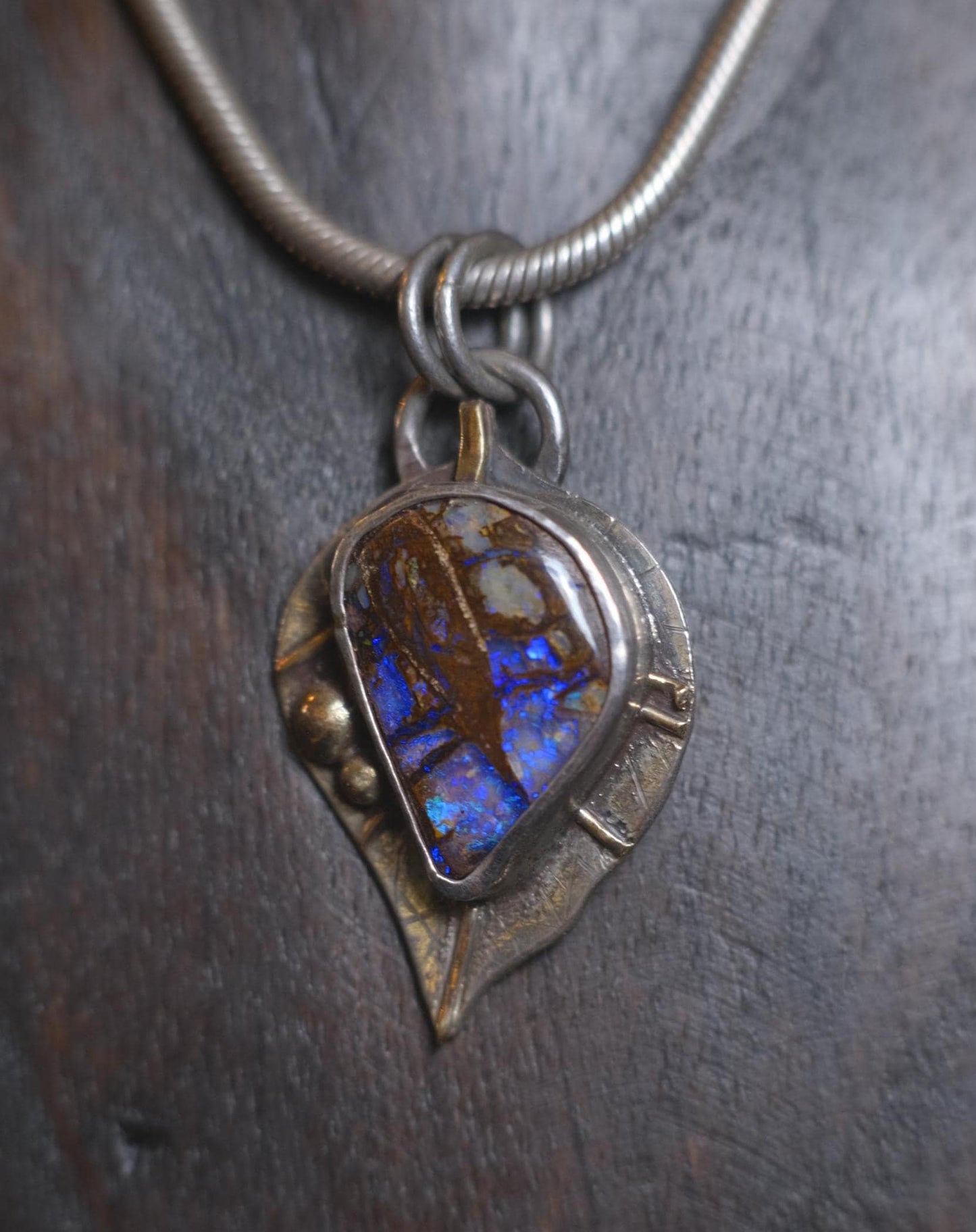 Wood Fossil Boulder Opal set in Leafy Motif Textured Silver and Gold Pendant