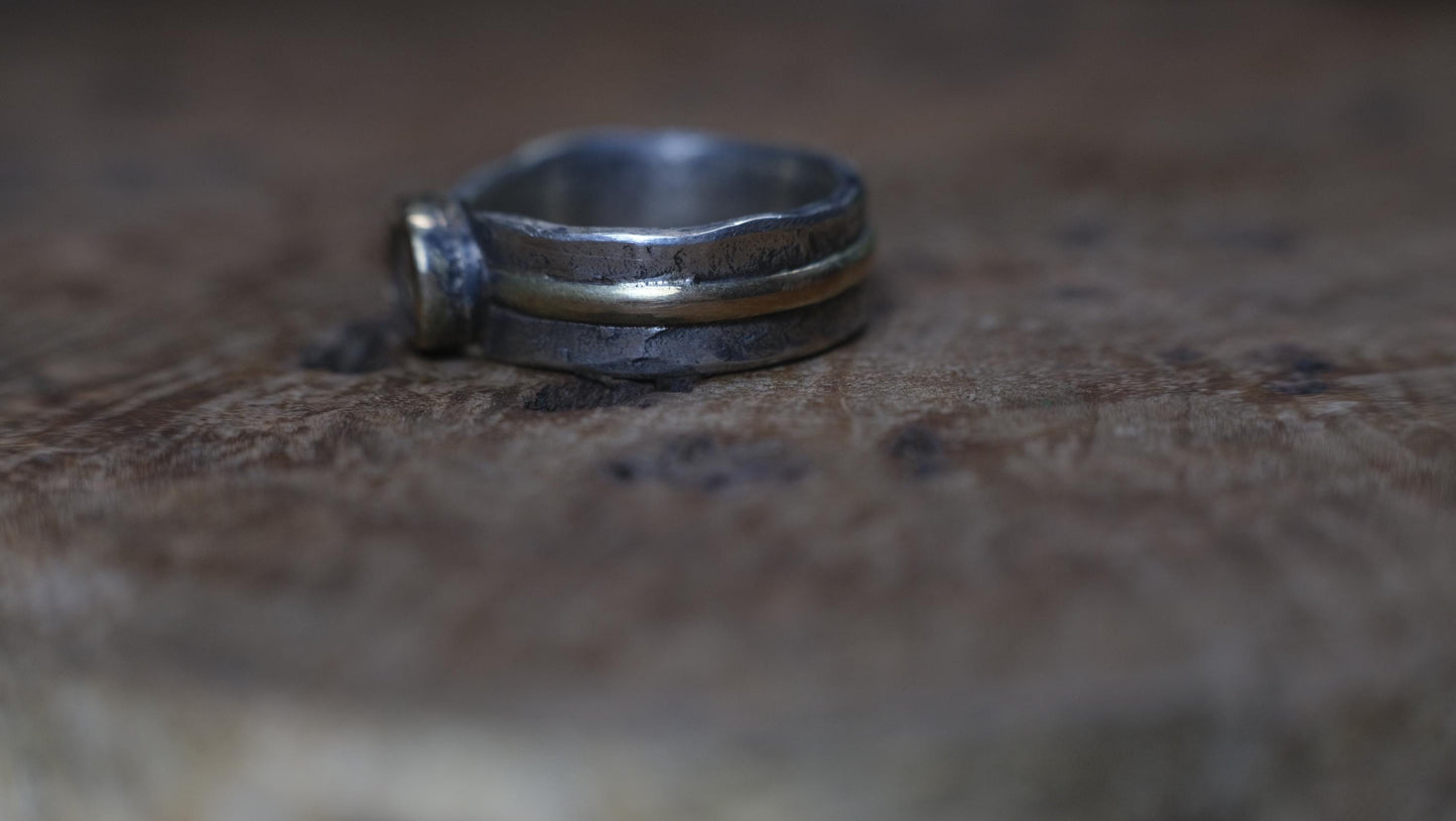 Dazzling boulder opal set in 9ct gold and on a unique textured sterling silver band with 9 ct gold detail