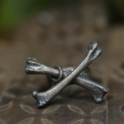 Handmade sterling silver crossbones ring with rugged oxidised pirate-inspired texture