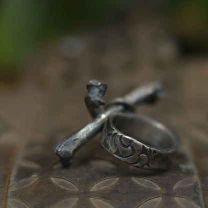 Handmade sterling silver crossbones ring with rugged oxidised pirate-inspired texture