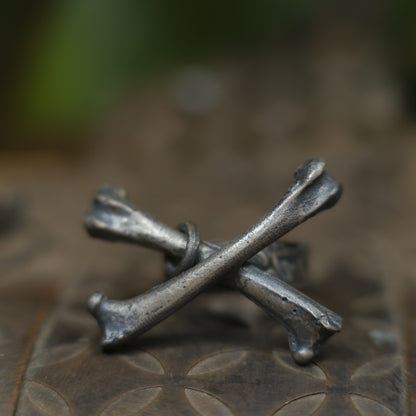 Handmade sterling silver crossbones ring with rugged oxidised pirate-inspired texture