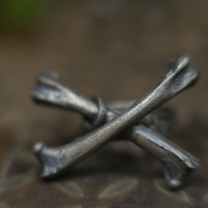 Handmade sterling silver crossbones ring with rugged oxidised pirate-inspired texture