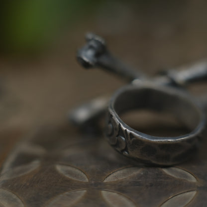 Handmade sterling silver crossbones ring with rugged oxidised pirate-inspired texture