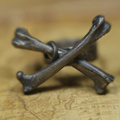 Handmade sterling silver crossbones ring with rugged oxidised pirate-inspired texture