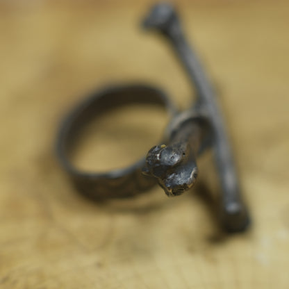 Handmade sterling silver crossbones ring with rugged oxidised pirate-inspired texture