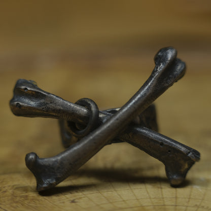 Handmade sterling silver crossbones ring with rugged oxidised pirate-inspired texture