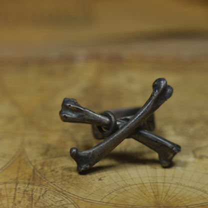 Handmade sterling silver crossbones ring with rugged oxidised pirate-inspired texture