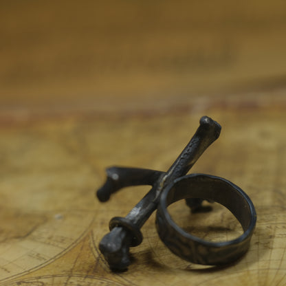 Handmade sterling silver crossbones ring with rugged oxidised pirate-inspired texture