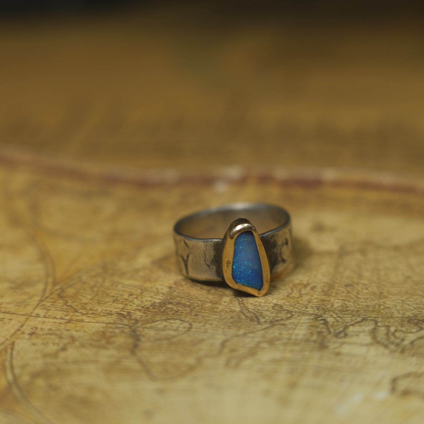 Bold Electric Blue Australian Opal Set in 9 ct Gold on a textured Sterling Silver Ring