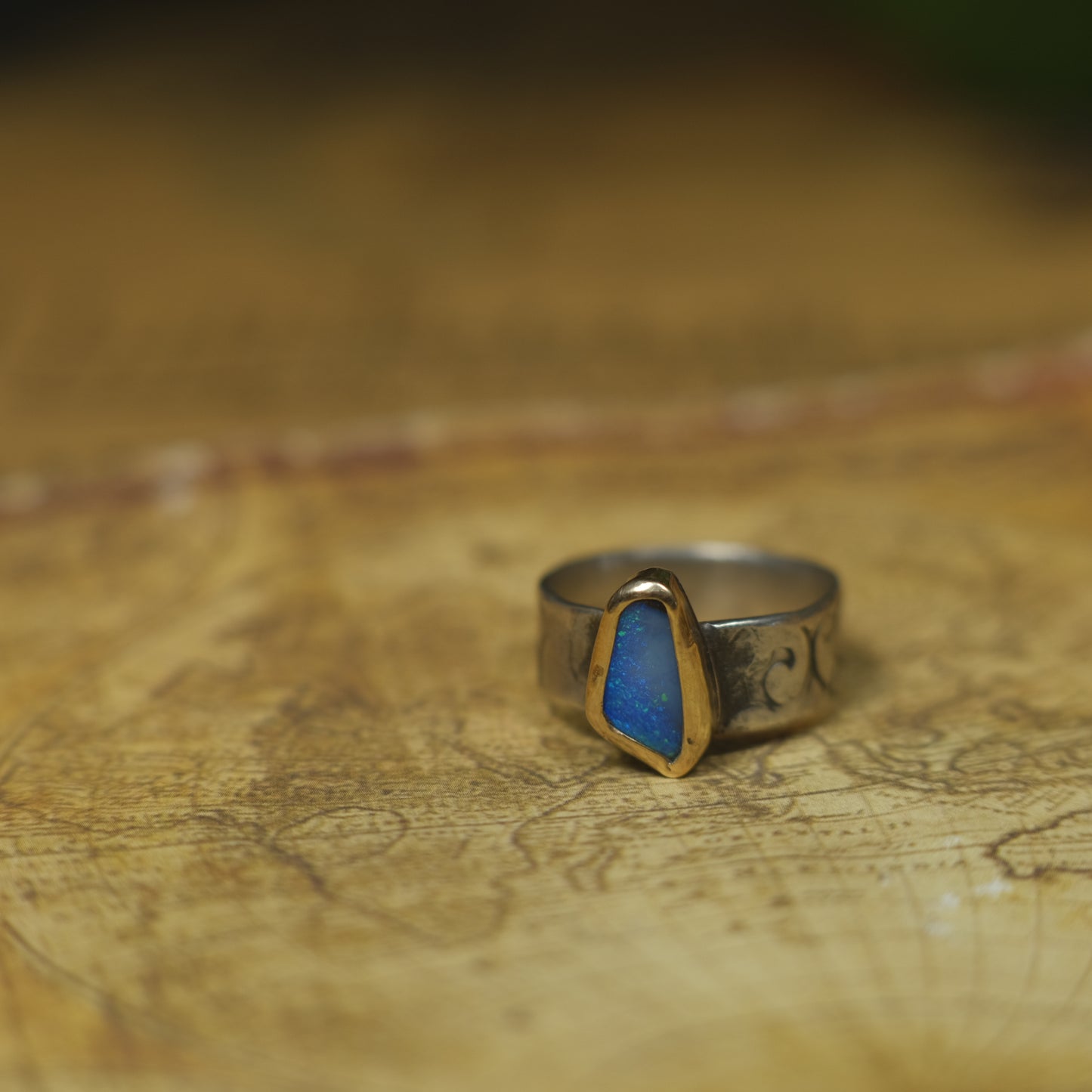 Bold Electric Blue Australian Opal Set in 9 ct Gold on a textured Sterling Silver Ring