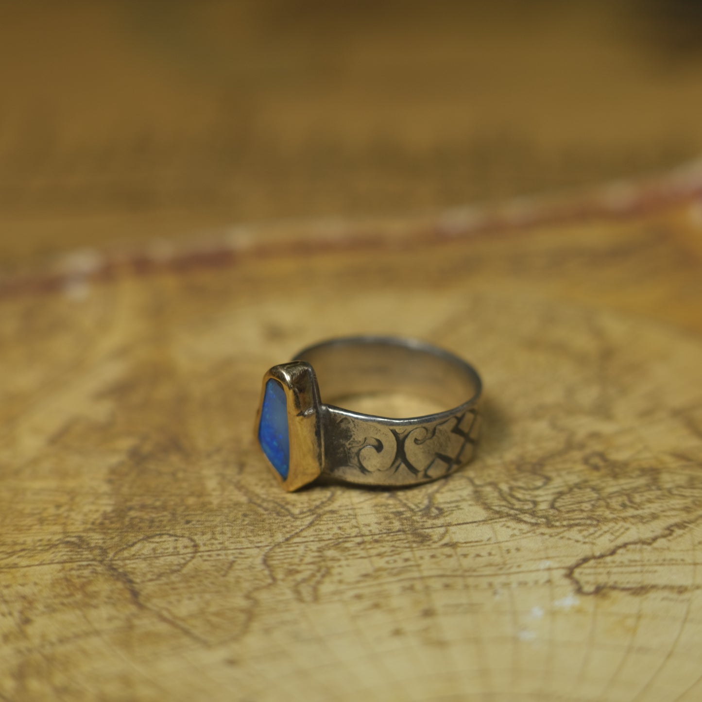 Bold Electric Blue Australian Opal Set in 9 ct Gold on a textured Sterling Silver Ring