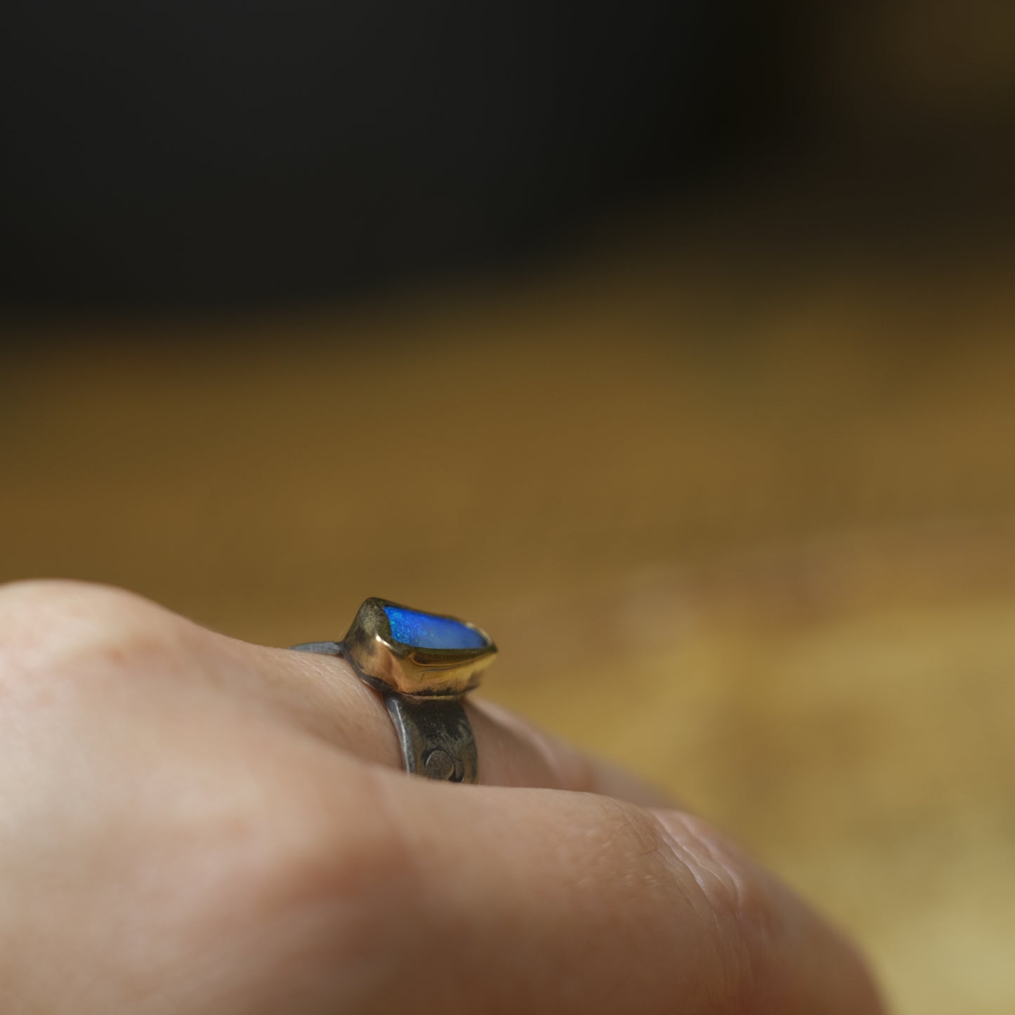 Bold Electric Blue Australian Opal Set in 9 ct Gold on a textured Sterling Silver Ring