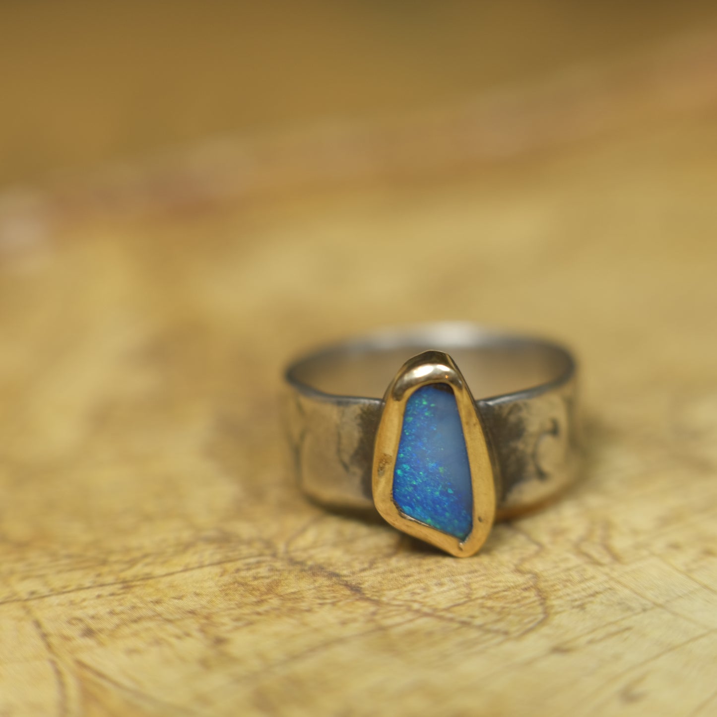 Bold Electric Blue Australian Opal Set in 9 ct Gold on a textured Sterling Silver Ring