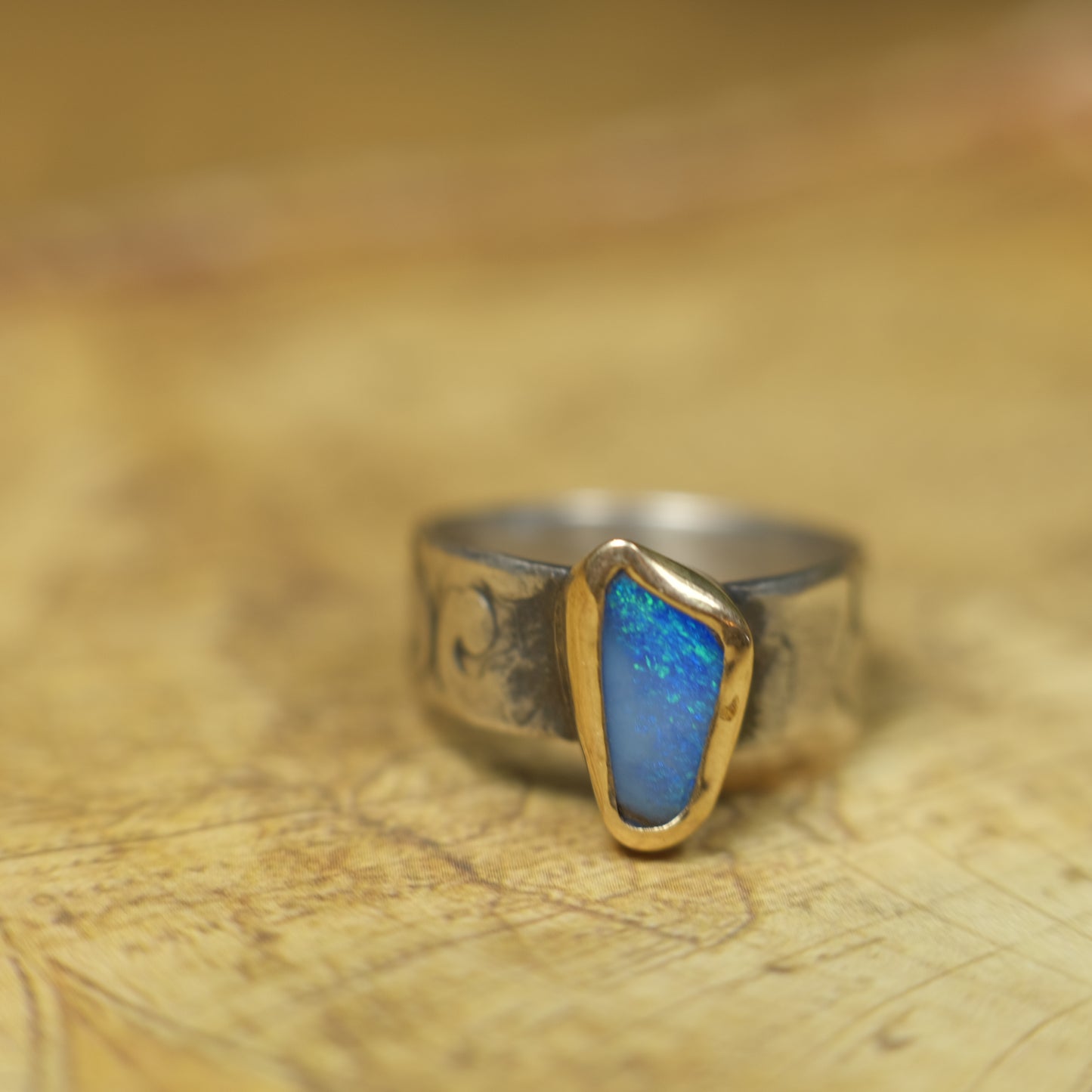 Bold Electric Blue Australian Opal Set in 9 ct Gold on a textured Sterling Silver Ring