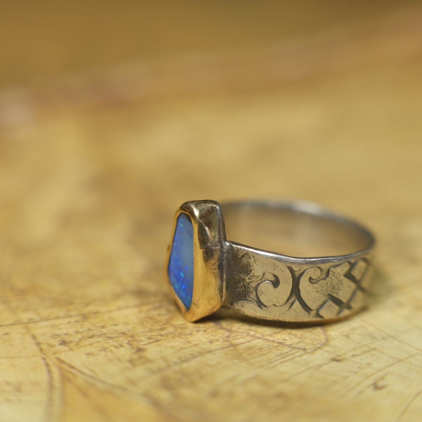 Bold Electric Blue Australian Opal Set in 9 ct Gold on a textured Sterling Silver Ring