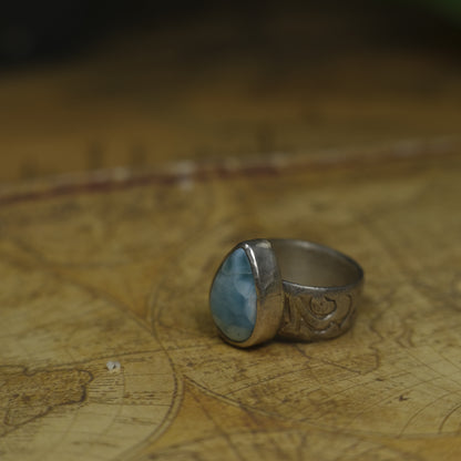 Larimar pirate ring with pale blue stone and textured oxidised sterling silver band