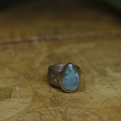 Larimar pirate ring with pale blue stone and textured oxidised sterling silver band