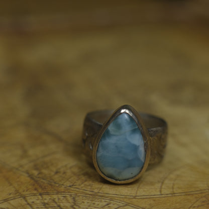 Larimar pirate ring with pale blue stone and textured oxidised sterling silver band