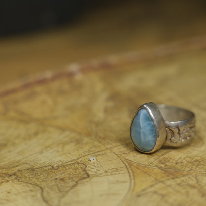 Larimar pirate ring with pale blue stone and textured oxidised sterling silver band