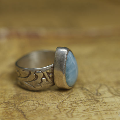 Larimar pirate ring with pale blue stone and textured oxidised sterling silver band