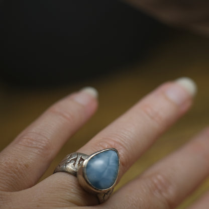 Larimar pirate ring with pale blue stone and textured oxidised sterling silver band