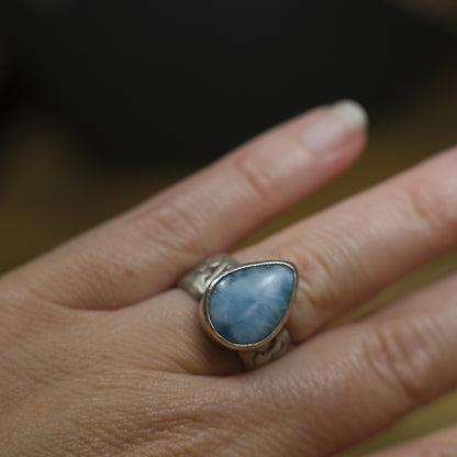 Larimar pirate ring with pale blue stone and textured oxidised sterling silver band