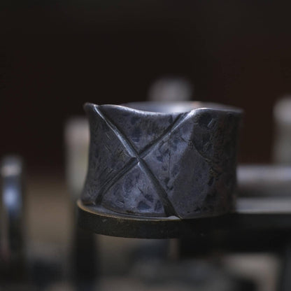 Rugged wide-band pirate-inspired sterling silver ring with oxidised hammered texture