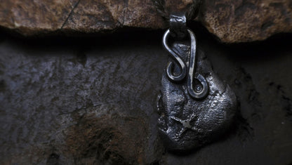 Handmade textured sterling silver pendant with oxidised finish on adjustable cord