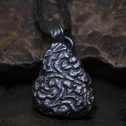 Handmade textured sterling silver pendant with oxidised finish on adjustable cord