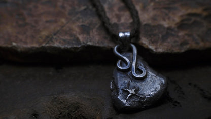 Handmade textured sterling silver pendant with oxidised finish on adjustable cord