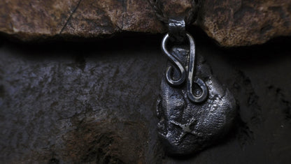 Handmade textured sterling silver pendant with oxidised finish on adjustable cord