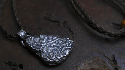 Handmade textured sterling silver pendant with oxidised finish on adjustable cord