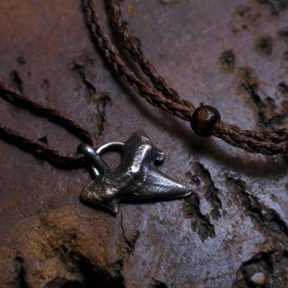 Sterling silver shark tooth talisman cast from a genuine fossil tooth on adjustable cord