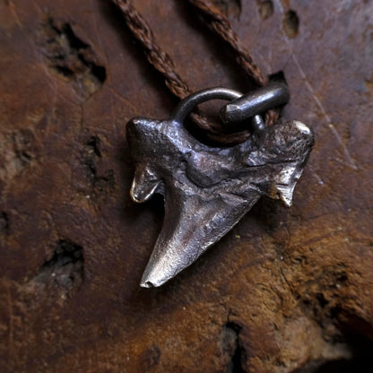 Sterling silver shark tooth talisman cast from a genuine fossil tooth on adjustable cord