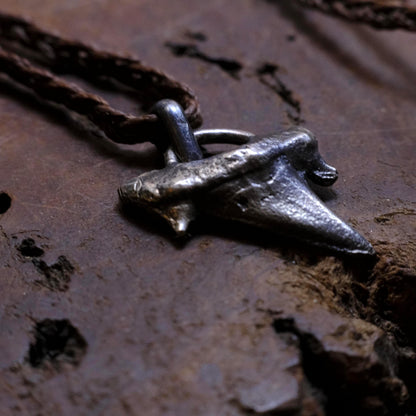 Sterling silver shark tooth talisman cast from a genuine fossil tooth on adjustable cord