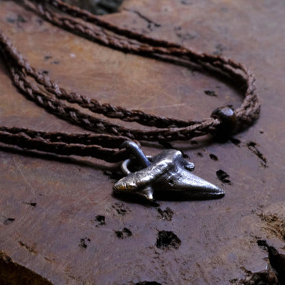 Sterling silver shark tooth talisman cast from a genuine fossil tooth on adjustable cord