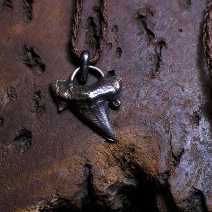 Sterling silver shark tooth talisman cast from a genuine fossil tooth on adjustable cord