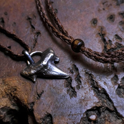 Sterling silver shark tooth talisman cast from a genuine fossil tooth on adjustable cord