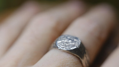 Rugged round sterling silver signet ring with handmade sand-cast texture