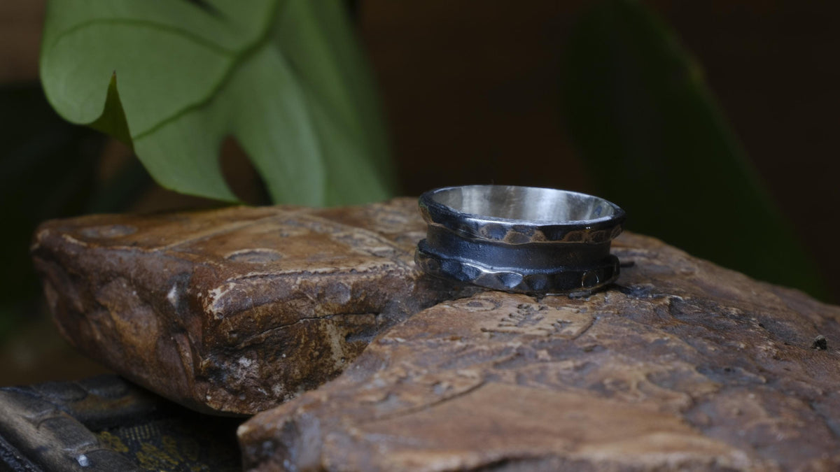 The Valley wide sterling silver ring with hammered edges and dark oxidised centre