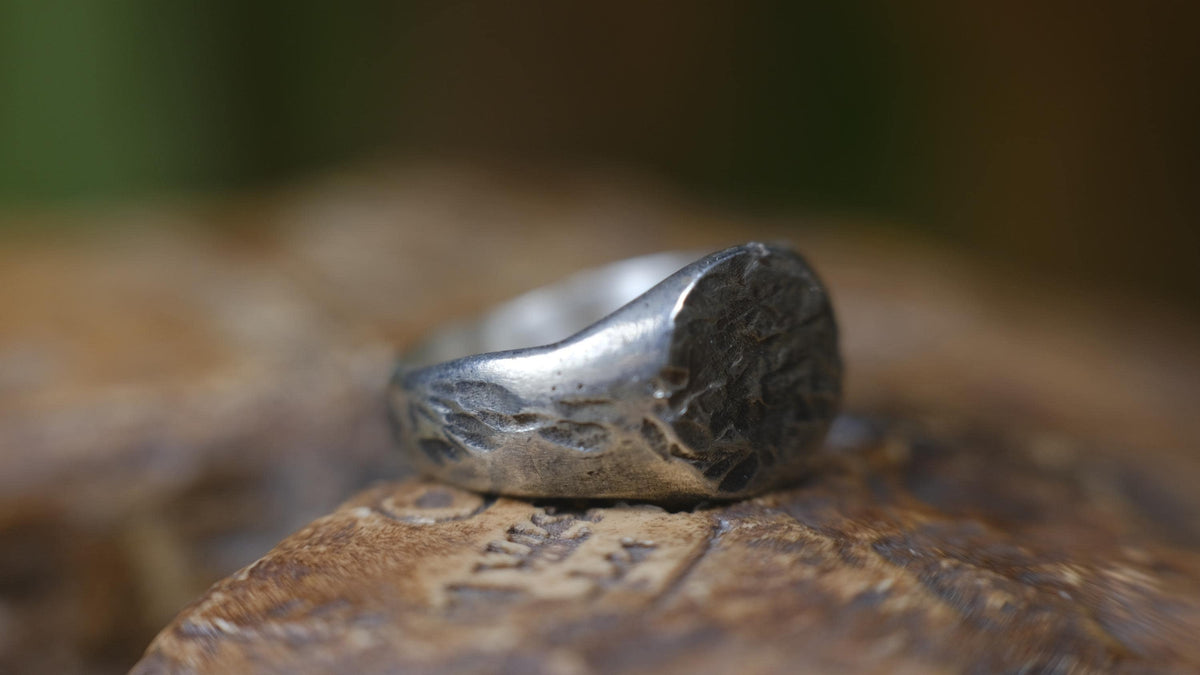Rugged round sterling silver signet ring with handmade sand-cast texture