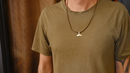 Handmade sterling silver whale tail talisman pendant on adjustable woven cord