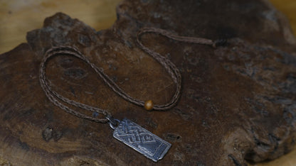 Handmade sterling silver Endless Knot Temple Relic talisman on adjustable cord