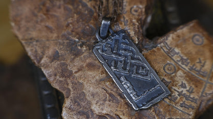 Handmade sterling silver Endless Knot Temple Relic talisman on adjustable cord