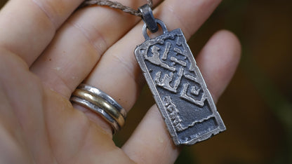 Handmade sterling silver Endless Knot Temple Relic talisman on adjustable cord