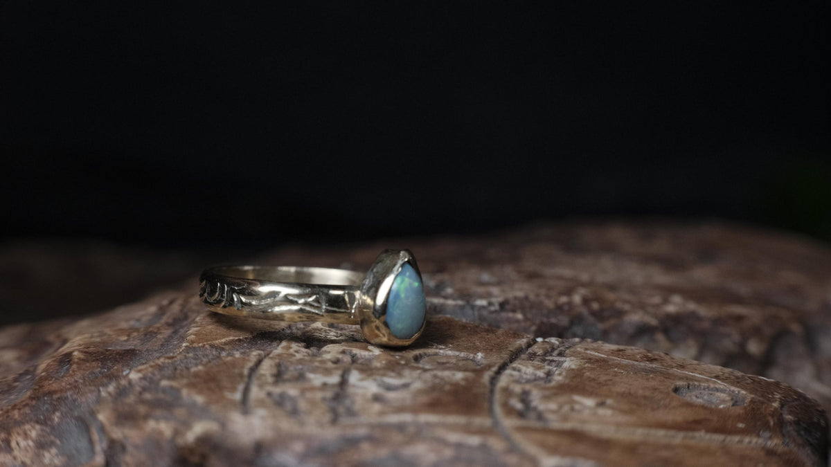 Crystal opal and patterned 9ct gold ring from the front