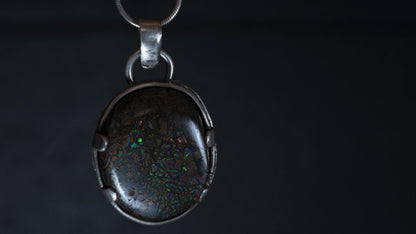 Close-up of Koroit matrix opal in sterling silver claws