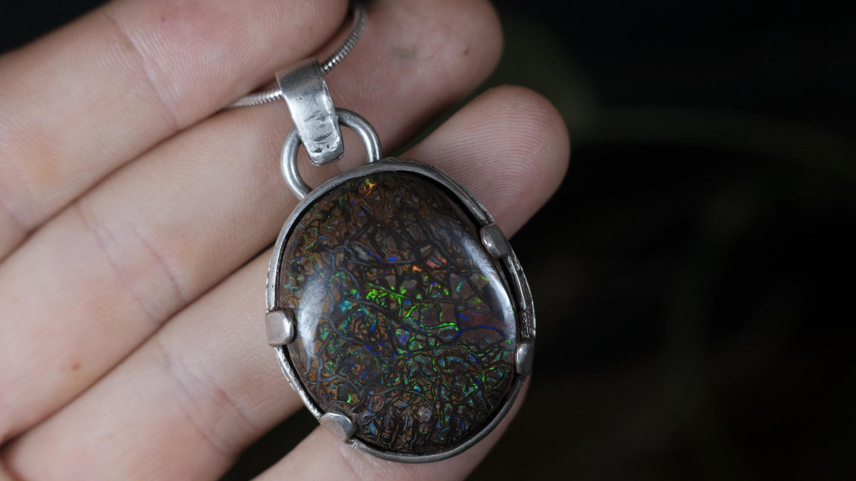 Australian Koroit matrix opal pendant with rugged silver setting