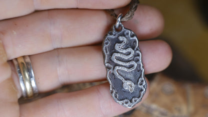 Handmade sterling silver Serpentine Temple Relic talisman with ancient serpent motif