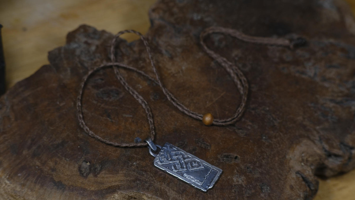 The Endless Knot or Shrivatsa Temple Relic Talisman Pendant in Sterling Silver on Adjustable Cord